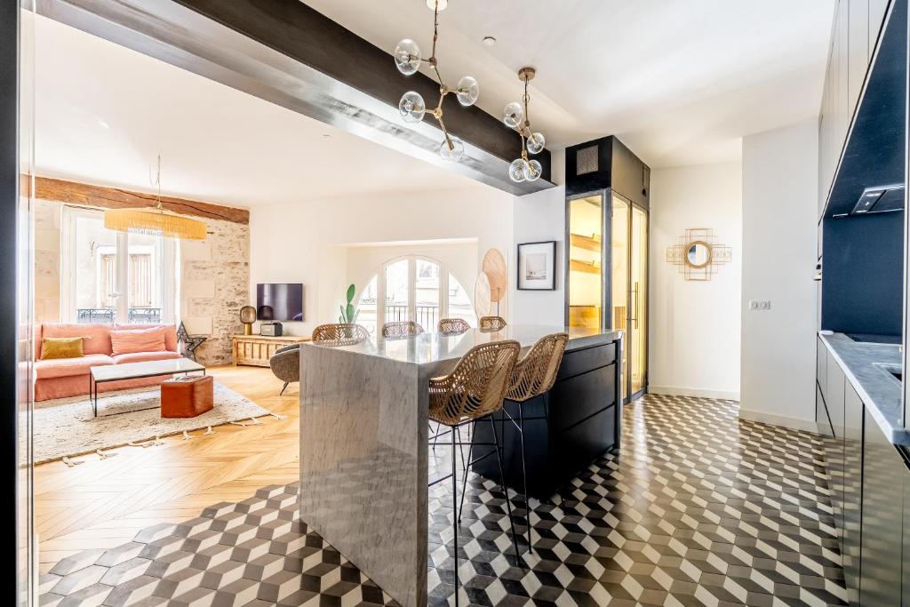 Open plan — living room into kitchen, geometric floor tiles