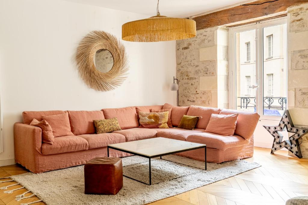 Living room — sofa close-up, exposed beam, stone wall